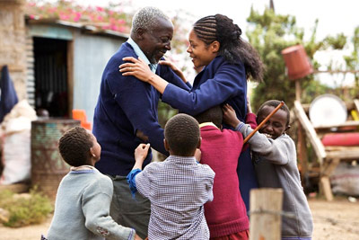 Maruge and the children welcome Jane back to school